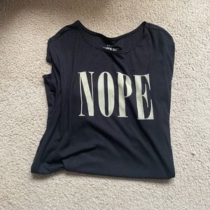 Short sleeve, ribbed black graphic shirt.